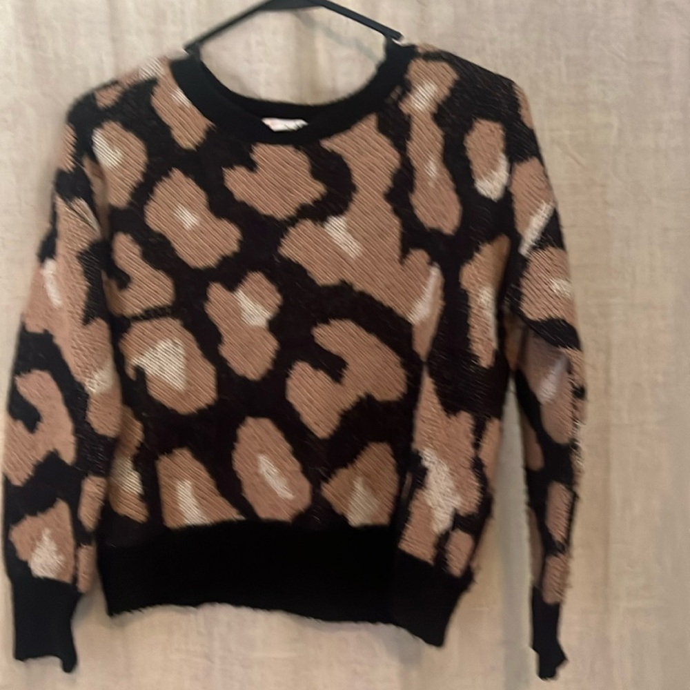 Girls size large leopard print sweater.
